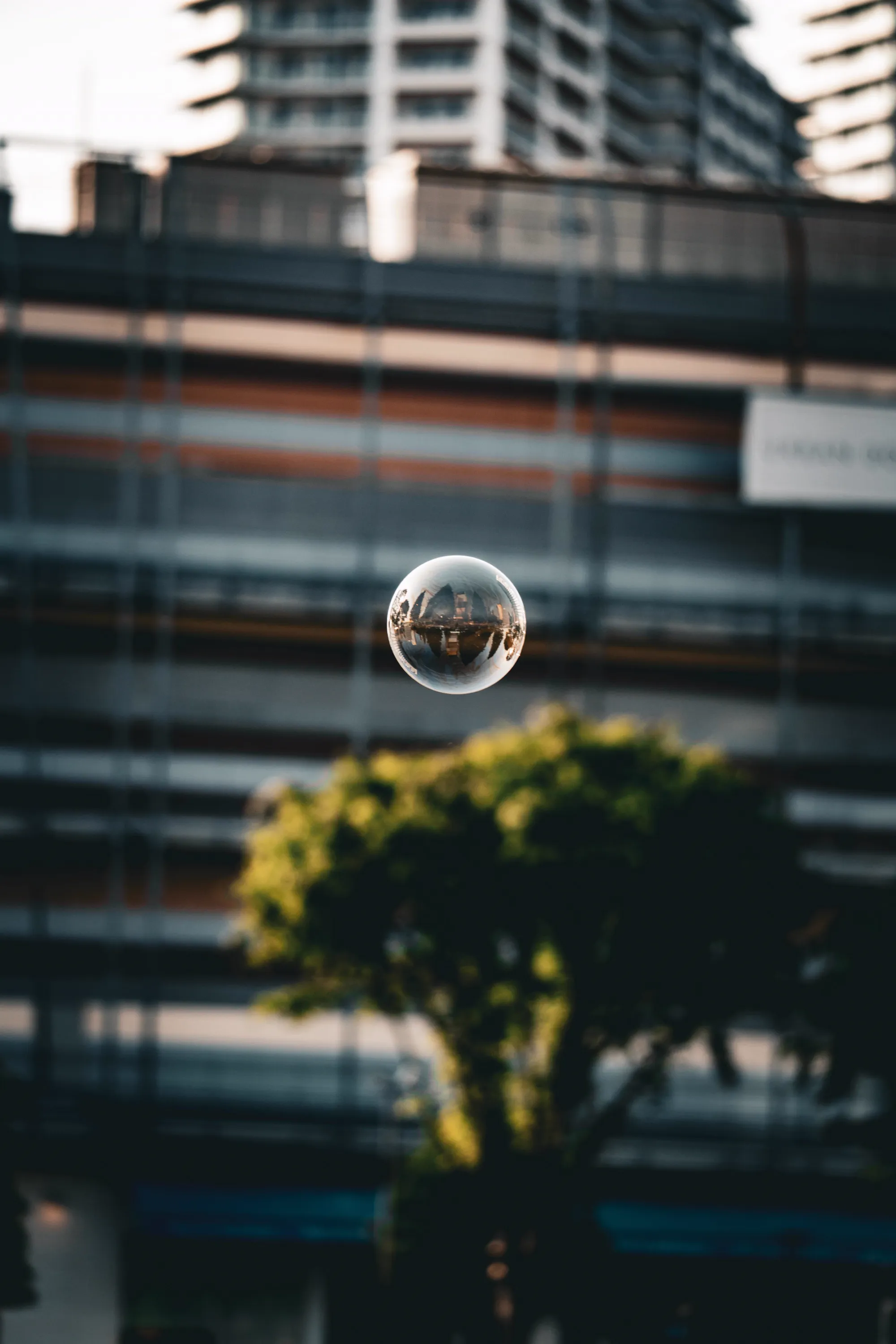 A floating bubble refracting the skyline upside down.